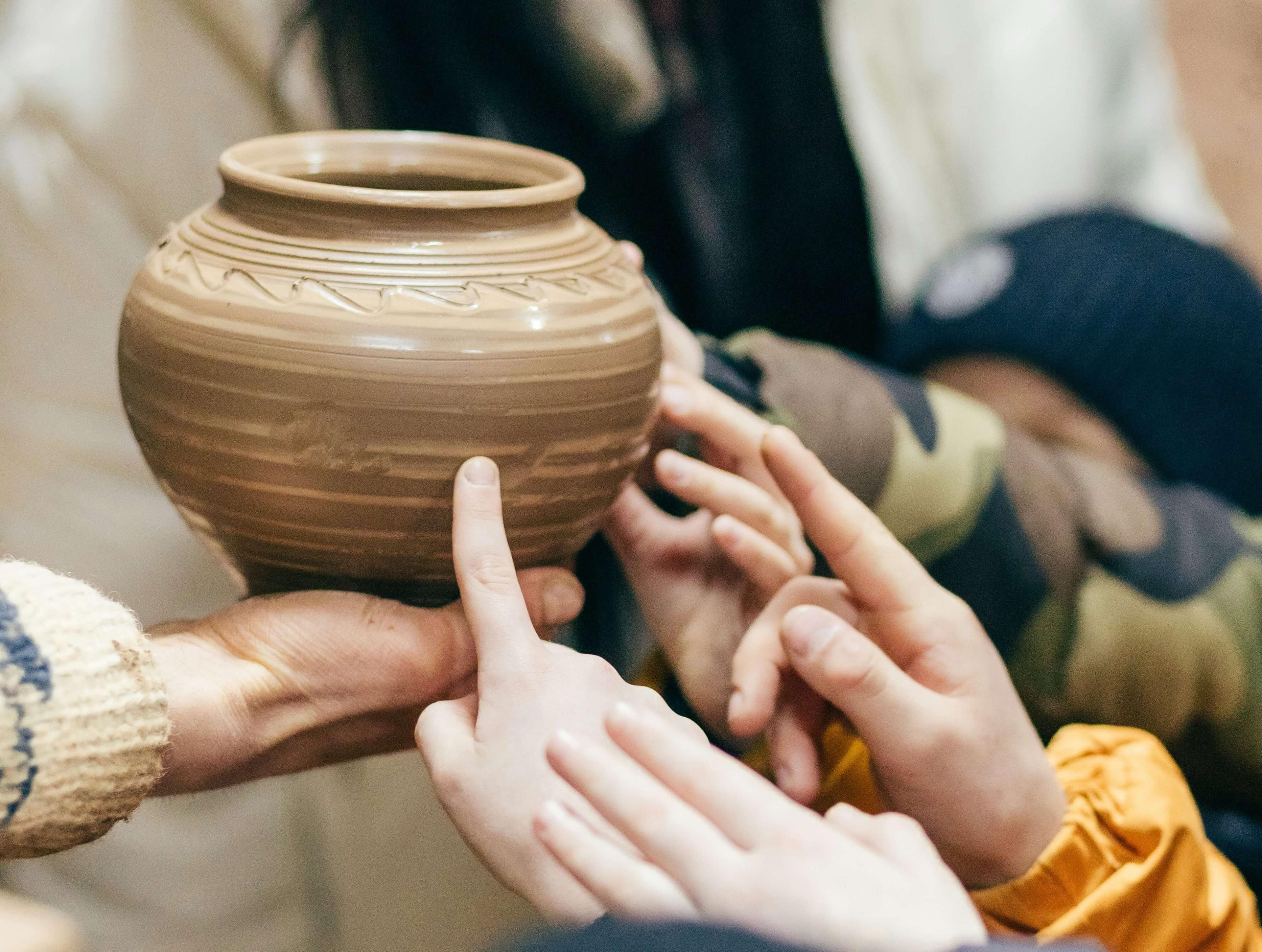 Hands holding a flower